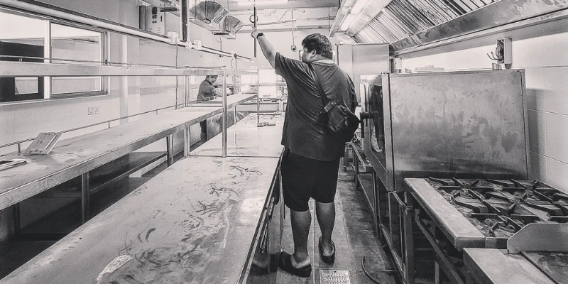 Ahong walking through the prep kitchen of Grub by Ahong & Friends located in Petaling Jaya.