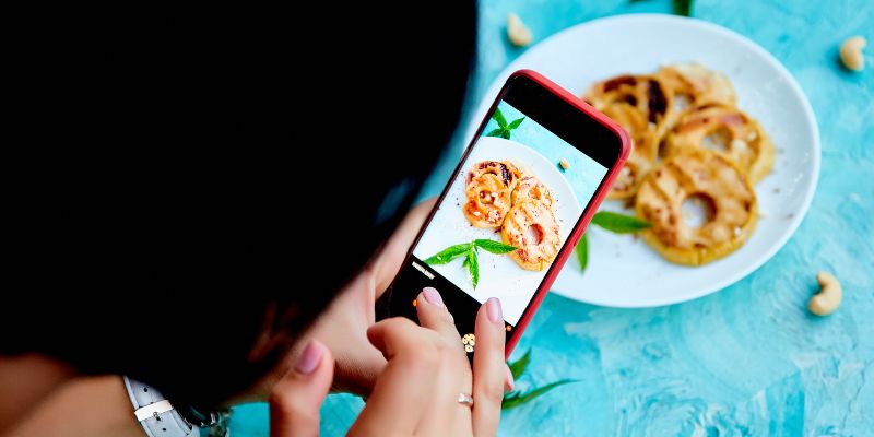 A female customer taking photos of food