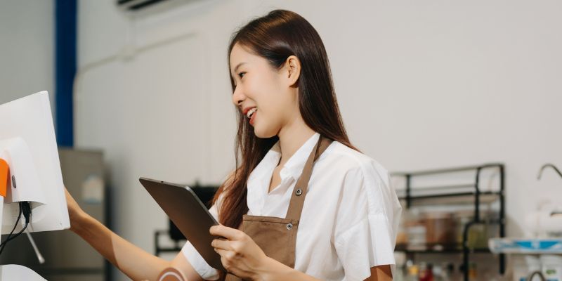 A F&B business owner with a POS system and iPad