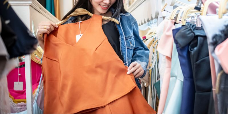 A Malaysian retail shopper trying on clothes