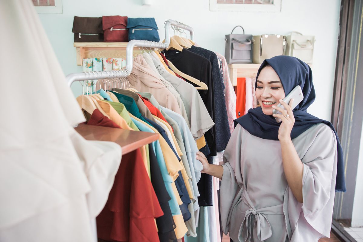 A Malaysian retail shopper browsing through clothes